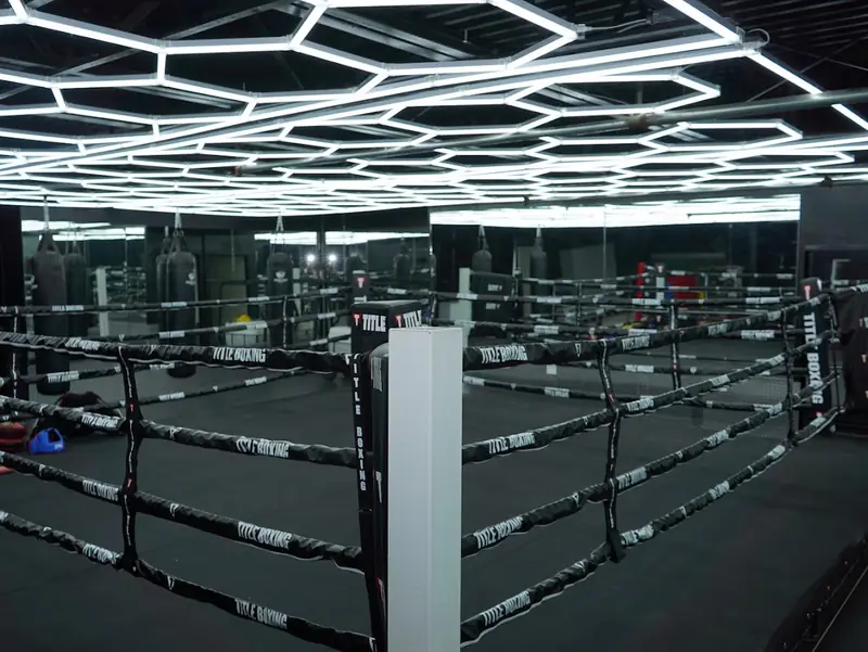 The competition-size boxing ring at MF Training SB with red corner posts